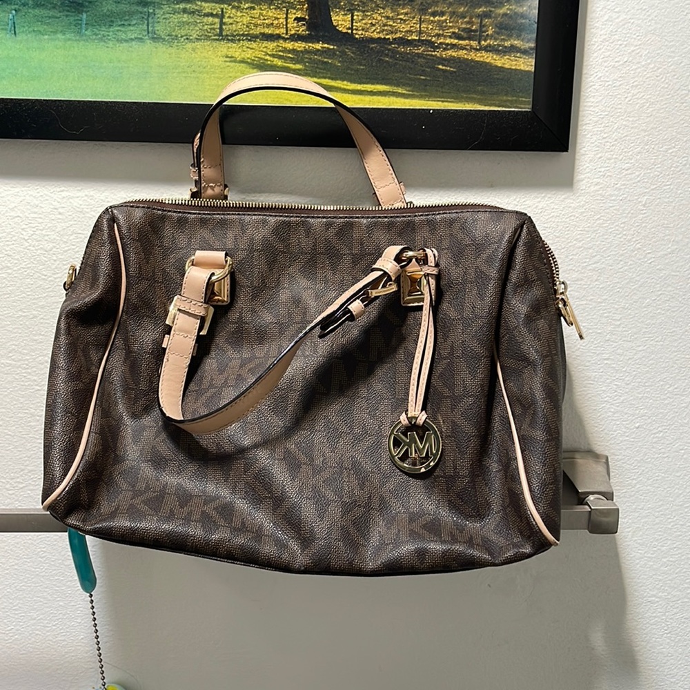 Michael Kors signature brown purse used once and it’s been sitting in a closet